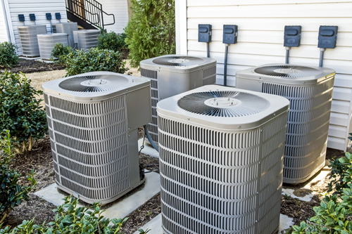 Group of Air Conditioning Units At Apartment Complex