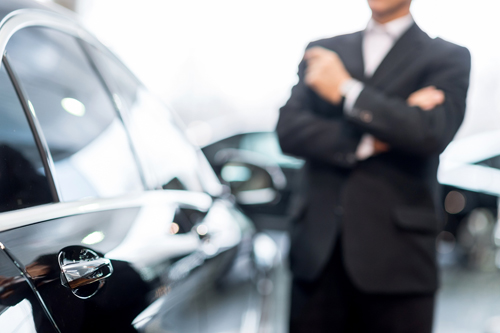 Choosing a car at dealership.
